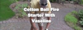 man lighting vaseline soaked cotton ball with ferro rod