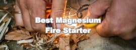 man using magnesium fire starter tool to start campfire